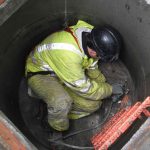 engineer carrying out repairs in manhole