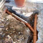 repairs being made to drainage pipes