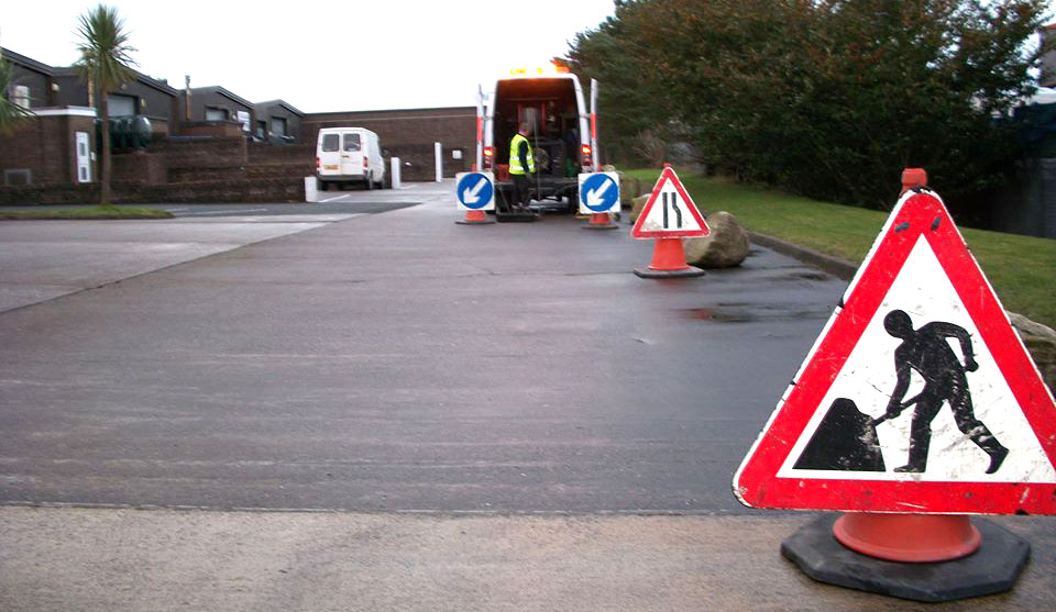emergency callout for blocked drains with roadwork sign